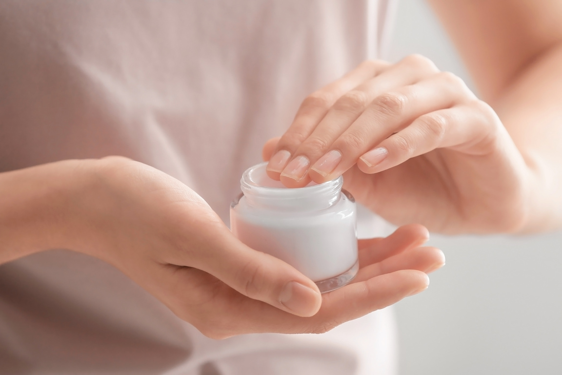 Hand Model Holding a Cream in a Jar